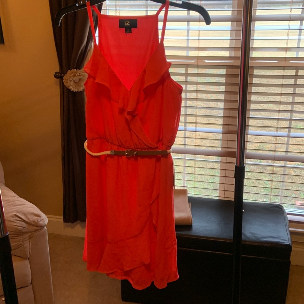 Never been worn. Coral color with belt.